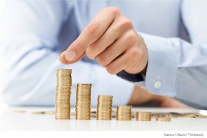 man-stacking-coins