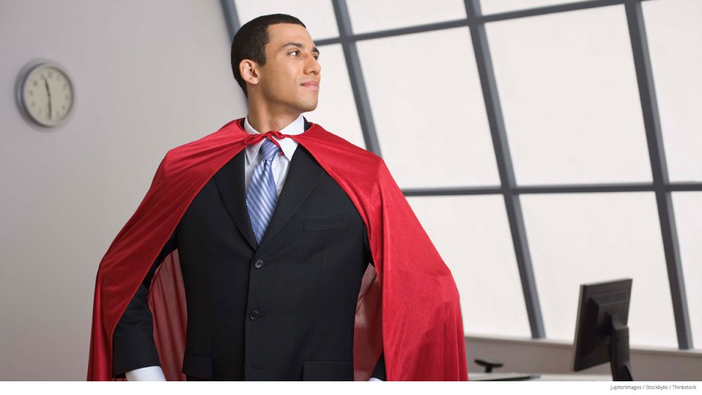 Businessman wearing cape