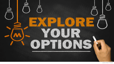 Chalk line drawing in white and yellow on a blackboard of lightbulbs with text reading, “Explore your options” next to a hand holding a stick of chalk.
