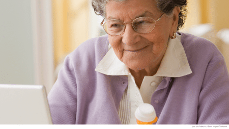 A woman looks online to find out whether her prescription is covered in her Medicare Part D formulary.