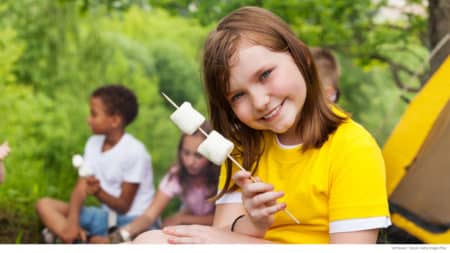 Girl ready to make s'mores while camping