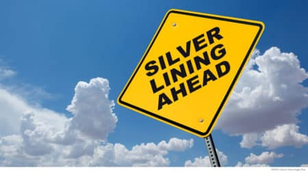 Street sign that says "silver lining ahead"