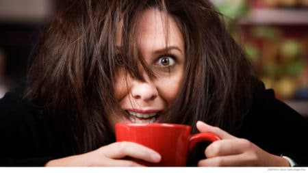 Woman getting her first cup of coffee in the morning